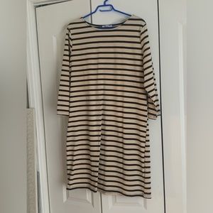 Good quality dress ,sand and black. Falls just above the knee, very comfortable.